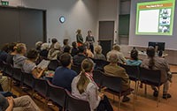 Presentation for adults in a seminar room.