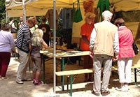 An Orangutans in Peril information stand with visitors.